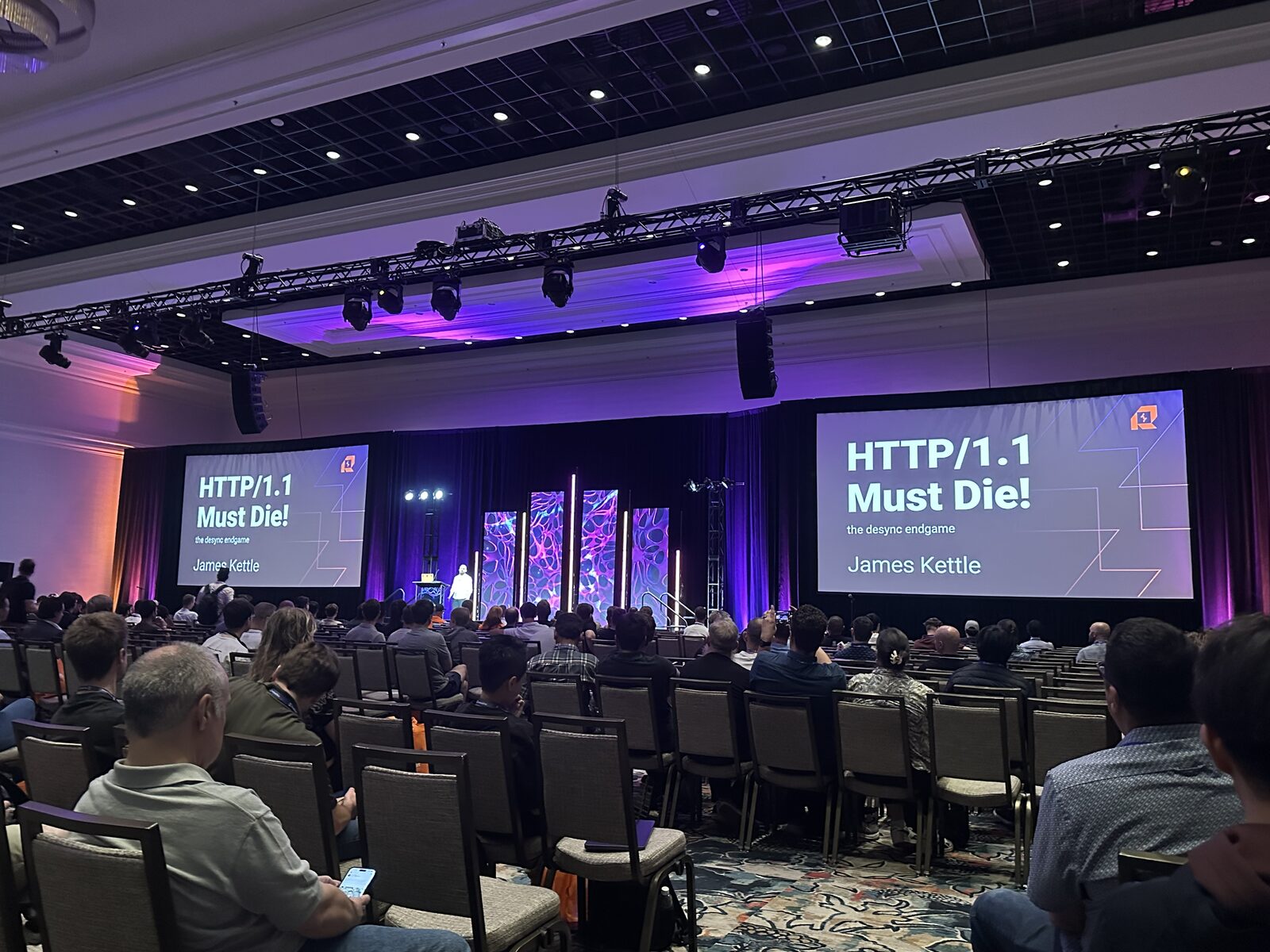 James Kettle's HTTP/1.1 Must Die talk at Black Hat USA 2025 — title slide on two giant screens, audience filling the room