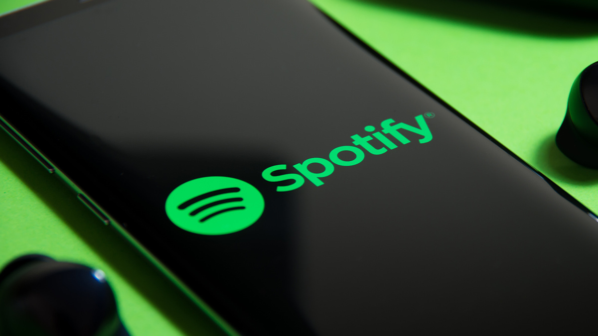 A phone displaying Spotify logo.